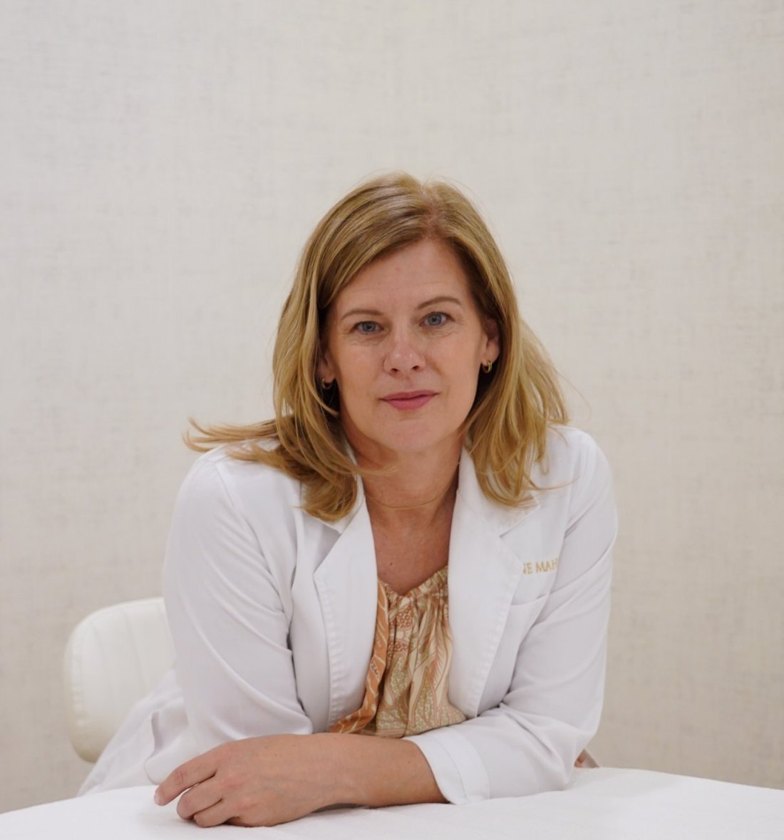 Dr. Janine Mahon in her white lab coat